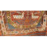 Turkish silk rug, the central field red ground with deer decoration, on a stepped border, in reds, c