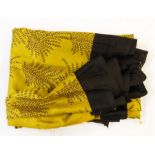 Five and a half yards of sari silk - ochre with black border and print pattern, a black crepe