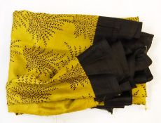 Five and a half yards of sari silk - ochre with black border and print pattern, a black crepe