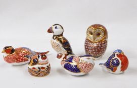 Collection of Royal Derby paperweights including goldfinch nesting, puffin and others in Imari-patte