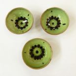 Three Winchcombe pottery Sydney Tustin bowls green glazed with brown wave decoration 16cm diameter