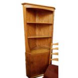 Light elm Ercol corner display cabinet with three open shelves above cupboard door, 179cm high