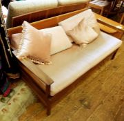 Mid 20th century teak-framed folding sofabed finished in pink upholstery probably Scandinavian