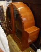 Early 20th century walnut display cabinet of Art Deco circular form, on bracket feet, 134cm x 126.