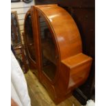 Early 20th century walnut display cabinet of Art Deco circular form, on bracket feet, 134cm x 126.