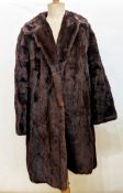 Two vintage fur coats, one being goatskin trimmed with mink, two faux-fur coats, a faux-fur shrug, a