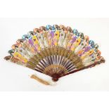 Japanese paper fan featuring Japanese ladies carrying parasols in traditional dress and another