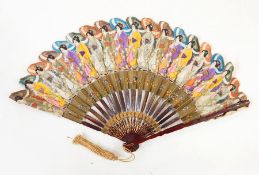 Japanese paper fan featuring Japanese ladies carrying parasols in traditional dress and another