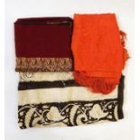Batik printed fabric, paisley pattern dark brown on cream ground, an orange silk embroidered shawl