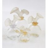 Four various Chloe bottles with lily frosted stoppers, Liz de Liz Paris bottle with flower head