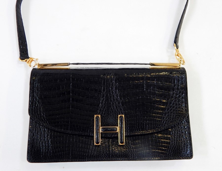 Vintage 1960's black crocodile handbag, labelled Selfridges International Collection, brass coloured