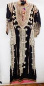 Middle Eastern robe/dress in black cotton, heavily embroidered with metal detail and cotton, gold-