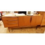 A H McIntosh & Co teak sideboard having three drawers and double-doored cupboard, long bar handles