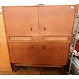 20th century teak cabinet by A H McIntosh & Co Ltd of Kirkcaldy, Scotland, the rectangular top above