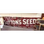 Enamel advertising sign for Sutton's Seeds, on a r