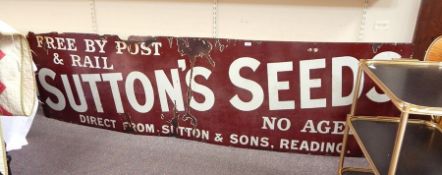Enamel advertising sign for Sutton's Seeds, on a r