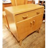 20th century light oak G-Plan cupboard with single drawer above two cupboard doors, on tapering