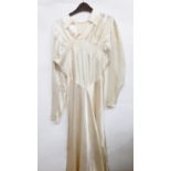 Three various vintage wedding dresses and a skirt with a train, probably originally part of a