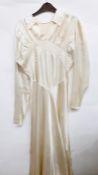 Three various vintage wedding dresses and a skirt with a train, probably originally part of a