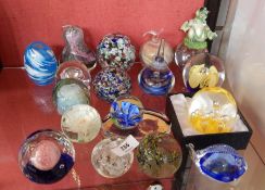 Large quantity of decorative glass paperweights to include fish-pattern, fruit-pattern, splatter