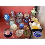 Large quantity of decorative glass paperweights to include fish-pattern, fruit-pattern, splatter