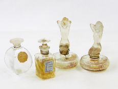 Three various Fleurs de Rocaille de Caron bottles, two with floral stoppers, two ADOREE bottles with