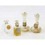 Three various Fleurs de Rocaille de Caron bottles, two with floral stoppers, two ADOREE bottles with