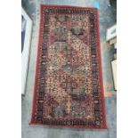 Modern machine made rug in reds, oranges and blacks 160 x 80 csm