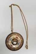 Foreign gold-coloured metal and enamel pendant, circular convex, flowerhead pierced and enamel