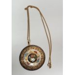 Foreign gold-coloured metal and enamel pendant, circular convex, flowerhead pierced and enamel