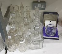 Group of decanters and stoppers to include a pair of cut mallet-shaped decanters with teardrop-