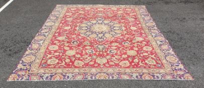 Modern antique Indian pattern carpet with central cream and blue ground stepped medallions on a pink