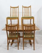 Light Ercol extending dining table with four slat back chairs Condition ReportThere are some small