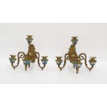 Pair of brass and porcelain-mounted wall lights each four-branch light mounted with Sevres-style