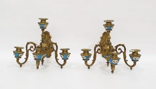 Pair of brass and porcelain-mounted wall lights each four-branch light mounted with Sevres-style