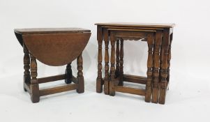 Twentieth century oak nest of three tables and one drop leaf oak coffee table on turned and ring