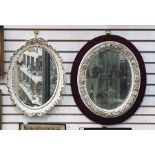 Continental porcelain white oval flower encrusted mirror, circa 1900, encrusted with continuous band