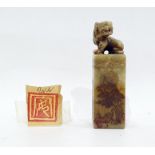 Chinese carved soapstone seal surmounted with a tiger, the square section seal engraved with