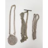 Silver graduated curb-link chain, 31g approx, a 1977 crown in pendant on chain and two other