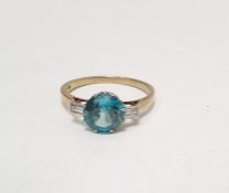 9ct gold blue stone and diamond dress ring set central blue circular stone flanked by two baguette