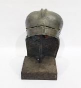 Historic replica armoured helmet on stand, engraved with trees, linear panels and dash ornament,