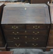 George III oak bureau with sloping fall front fitted interior with cupboard, drawers and