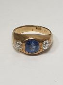 18ct gold, sapphire and diamond ring in rub-over setting, the central oval sapphire 1.5ct approx,