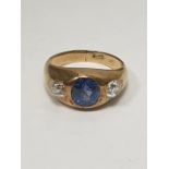 18ct gold, sapphire and diamond ring in rub-over setting, the central oval sapphire 1.5ct approx,