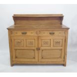 Early twentieth century oak sideboard with single shelf above rectangular top, above two drawers and
