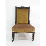 19th century walnut framed salon chair on turned front legs to castors