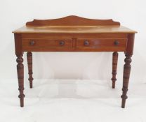 Victorian mahogany writing table with raised ledge back with thumb mould edge, pair short drawers