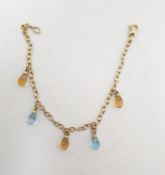 9ct gold and glass drop bracelet, the oval link chain with pale blue and yellow faceted glass