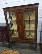 A 19th century mahogany and inlaid display case, with ogee moulded pediment above the swag inlaid