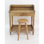 A late 19th/ early 20th century washstand with three quarter galleried top above a single drawer,